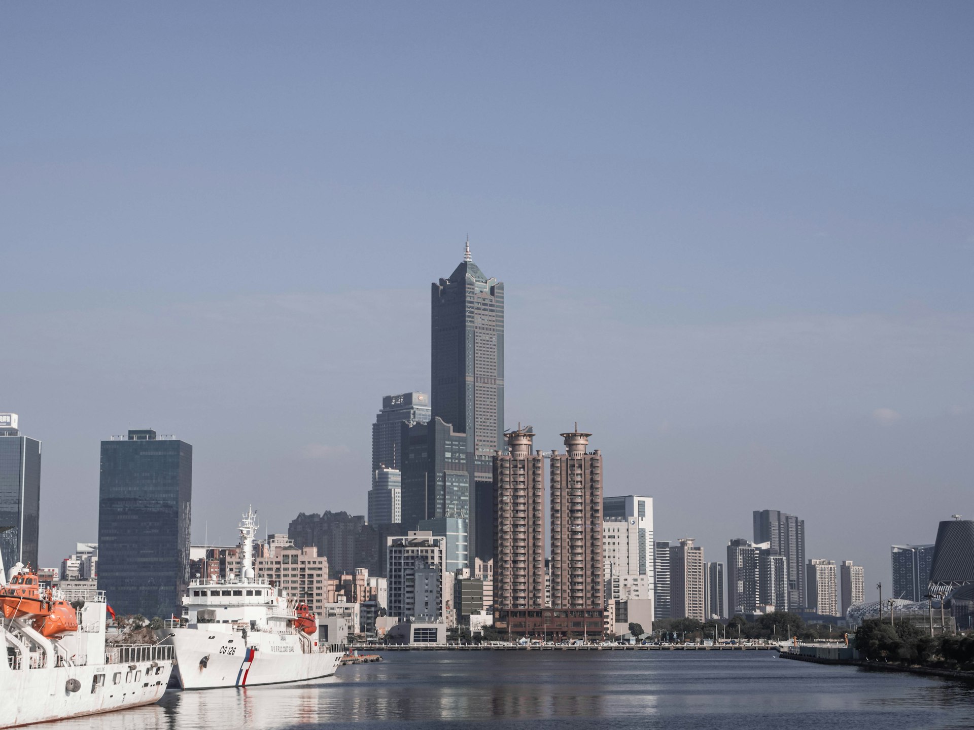 a city skyline with a boat
